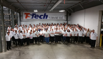 TriMold staff standing together in the factory